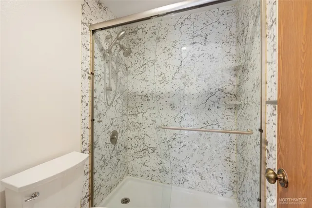 a bathroom with a bathtub and shower