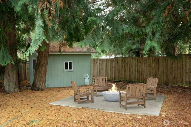 a view of a chairs and table in the patio
