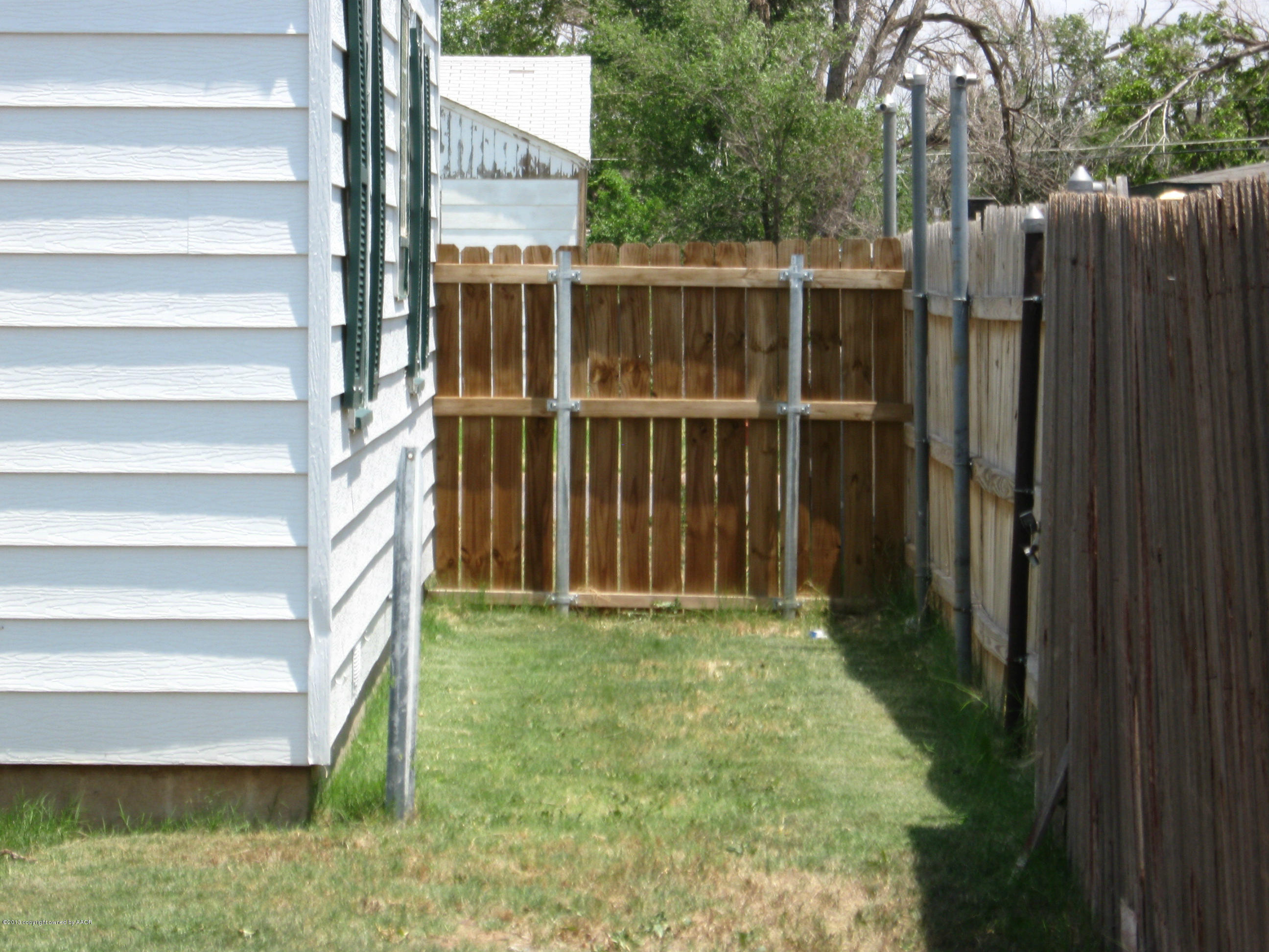 4410 South Lipscomb Street Amarillo, TX 79110 - Photo 13 of 19 a view of a backyard with door