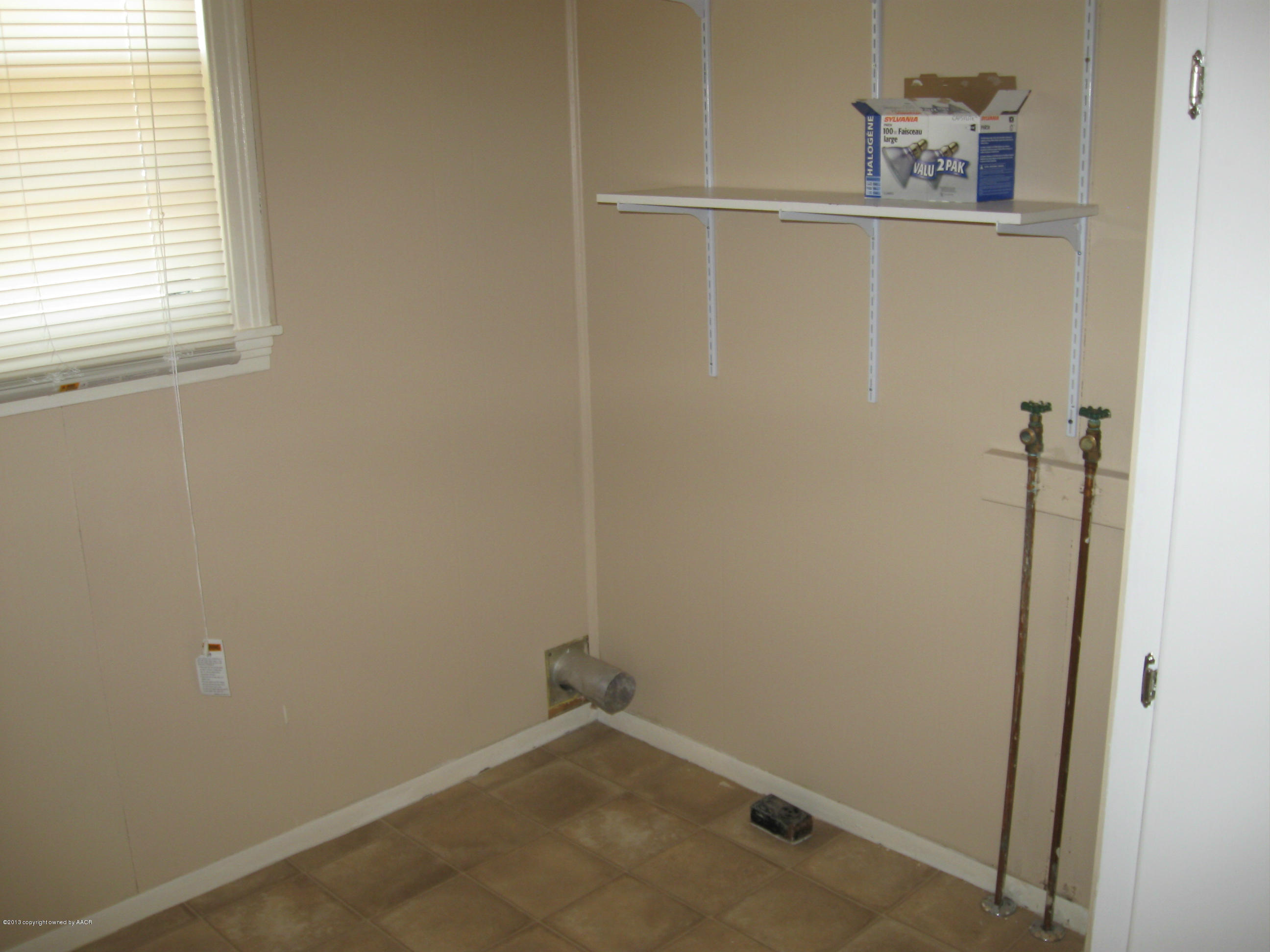 4410 South Lipscomb Street Amarillo, TX 79110 - Photo 14 of 19 a view of a small space with racks on the wall