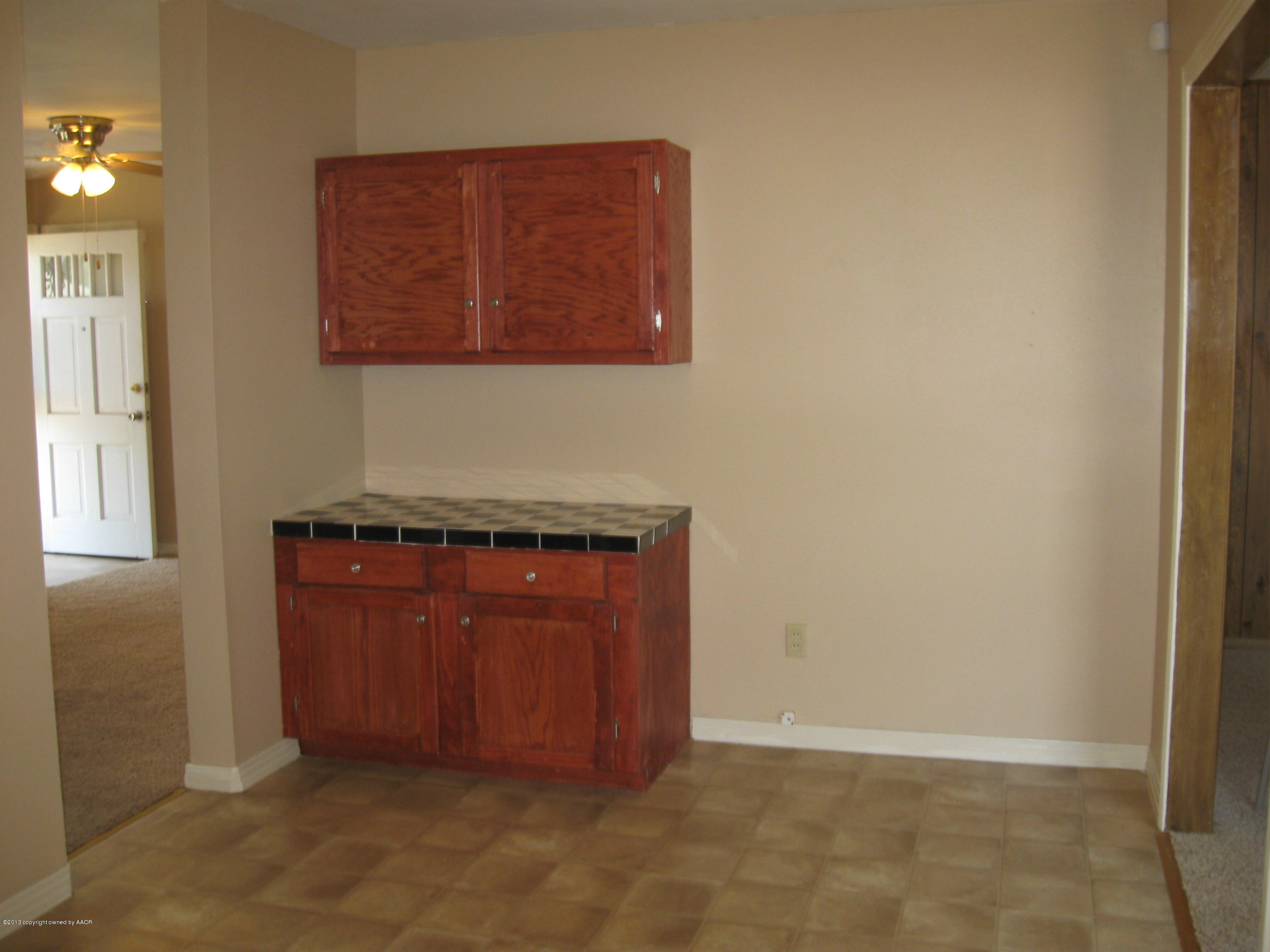 4410 South Lipscomb Street Amarillo, TX 79110 - Photo 17 of 19 an empty room with wooden floor and windows