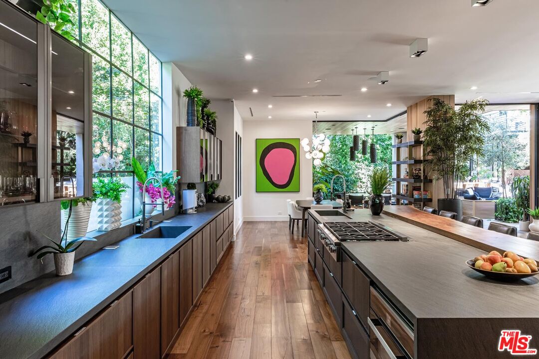 3904 Valley Meadow Road Encino, CA 91436 - Photo 11 of 27 a view of a kitchen with stainless steel appliances granite countertop lots of counter top space