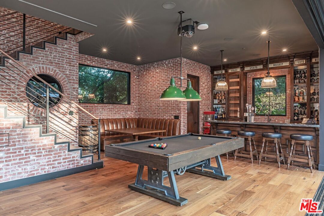 3904 Valley Meadow Road Encino, CA 91436 - Photo 14 of 27 a living room with furniture a rug and a large window