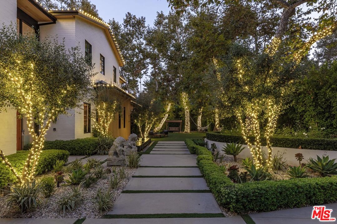 3904 Valley Meadow Road Encino, CA 91436 - Photo 24 of 27 a front view of a house with garden
