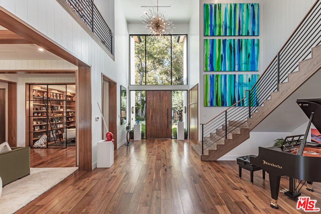 3904 Valley Meadow Road Encino, CA 91436 - Photo 4 of 27 a view of entryway with wooden floor and stairs