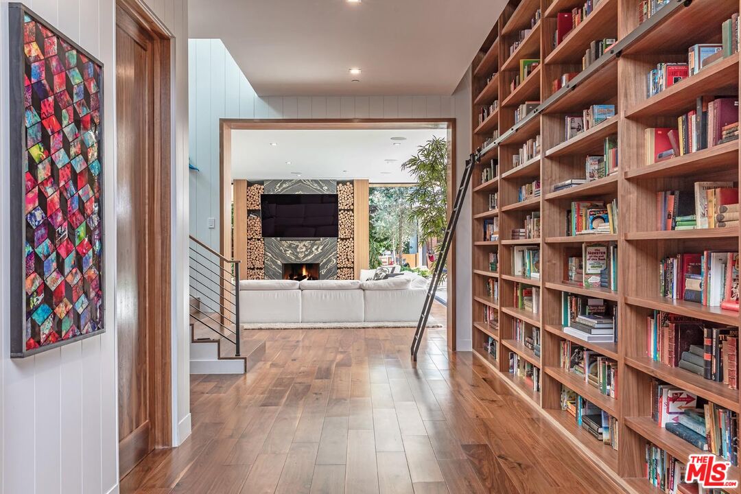 3904 Valley Meadow Road Encino, CA 91436 - Photo 9 of 27 a view of a living room and a book shelf