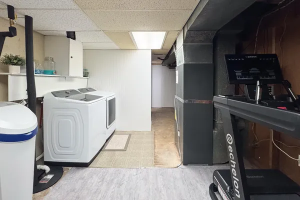 a bed room with furniture and a flat screen tv