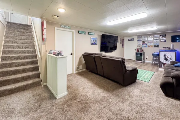 a living room with furniture and a window