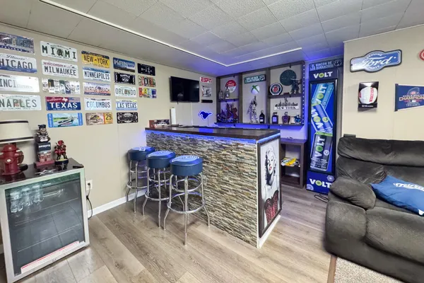 a bedroom with a bed and a dresser