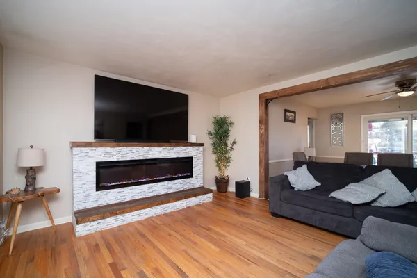 a living room with furniture fireplace and flat screen tv