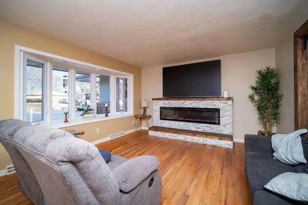 a dining room with furniture and window