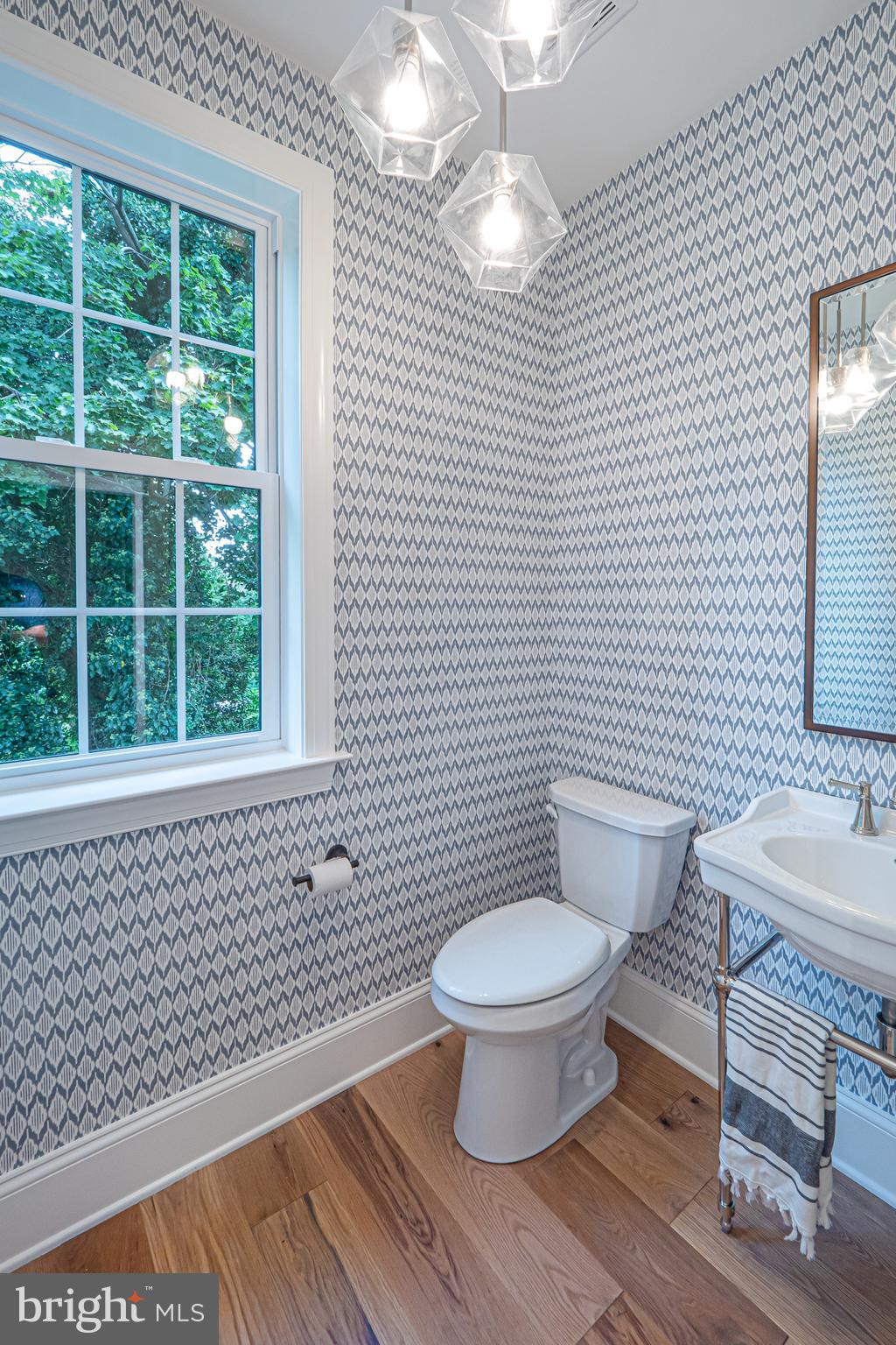 5 Timber Mill Lane, Unit BISCOTTO Landenberg, PA 19350 - Photo 13 of 70 a bathroom with a granite countertop toilet a sink a mirror and a window