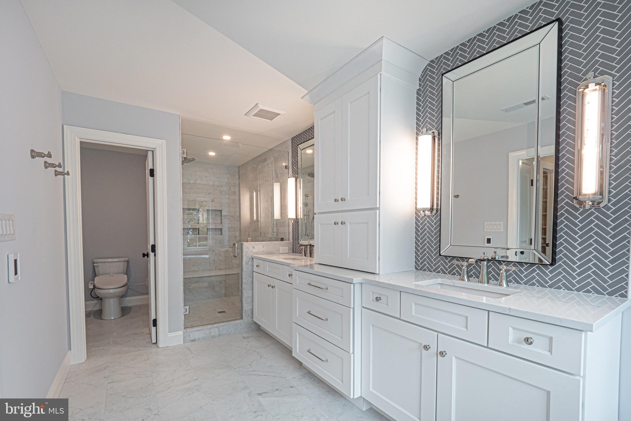 5 Timber Mill Lane, Unit BISCOTTO Landenberg, PA 19350 - Photo 55 of 70 a spacious bathroom with a granite countertop sink mirror and toilet