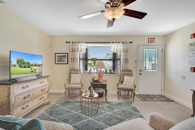 a room with a bed and a chandelier