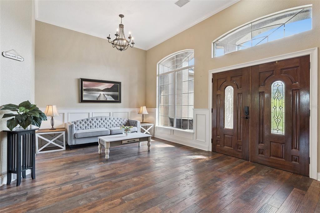 12736 Lake Ridge Circle Clermont, FL 34711 - Photo 13 of 56 a living room with furniture and a large window