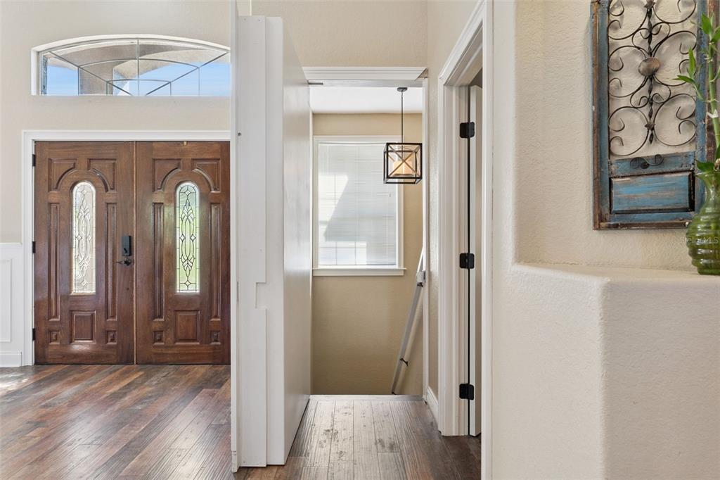 12736 Lake Ridge Circle Clermont, FL 34711 - Photo 15 of 56 a view of a livingroom with wooden floor and a window