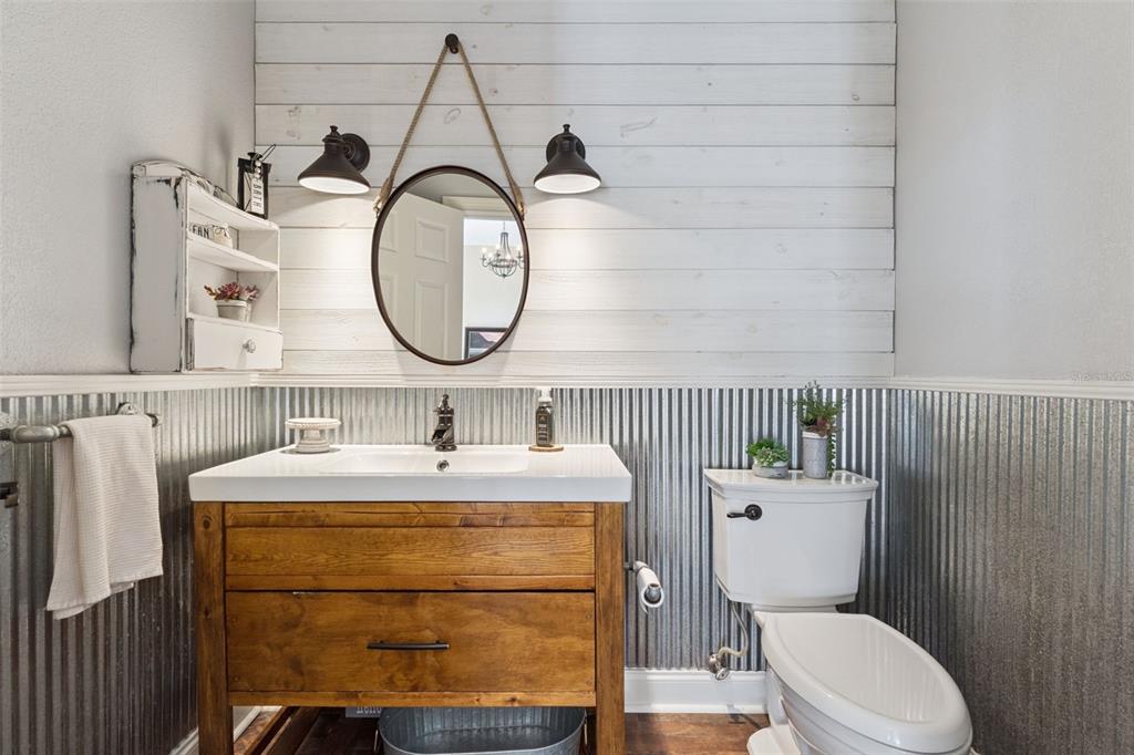12736 Lake Ridge Circle Clermont, FL 34711 - Photo 17 of 56 a bathroom with a toilet a sink and a mirror