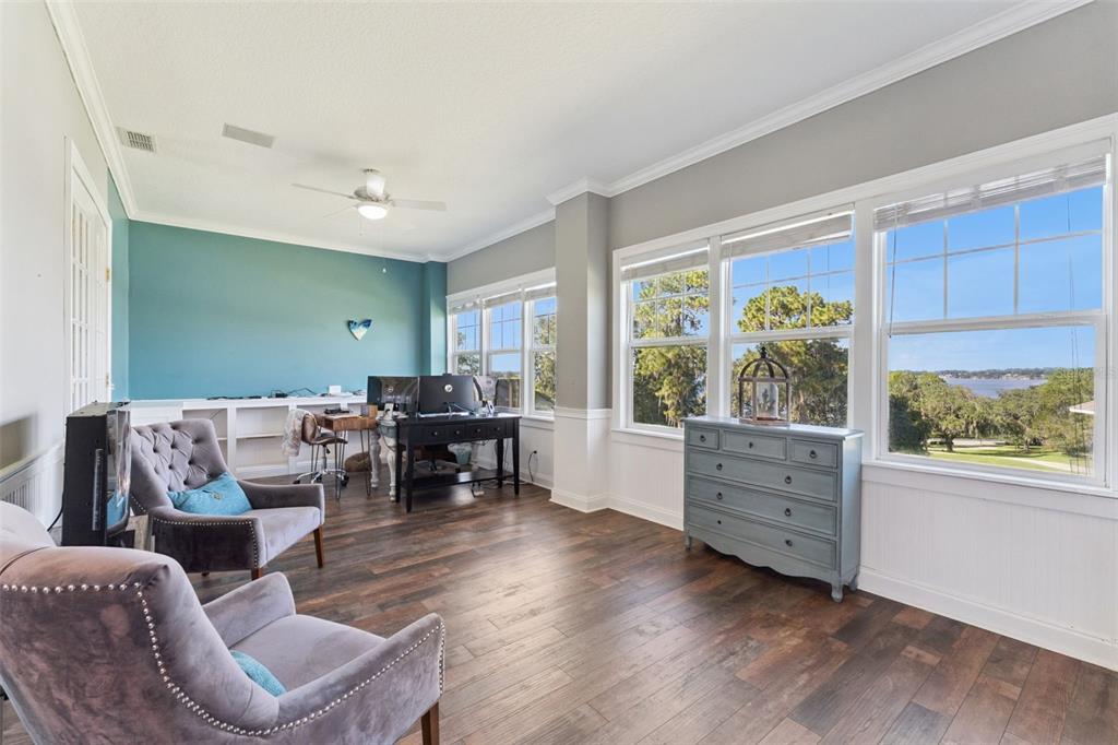 12736 Lake Ridge Circle Clermont, FL 34711 - Photo 20 of 56 a living room with furniture and a large window