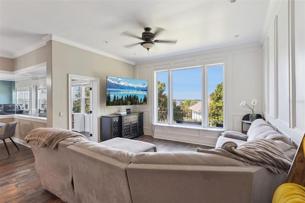 12736 Lake Ridge Circle Clermont, FL 34711 - Photo 22 of 56 a living room with furniture and a large window