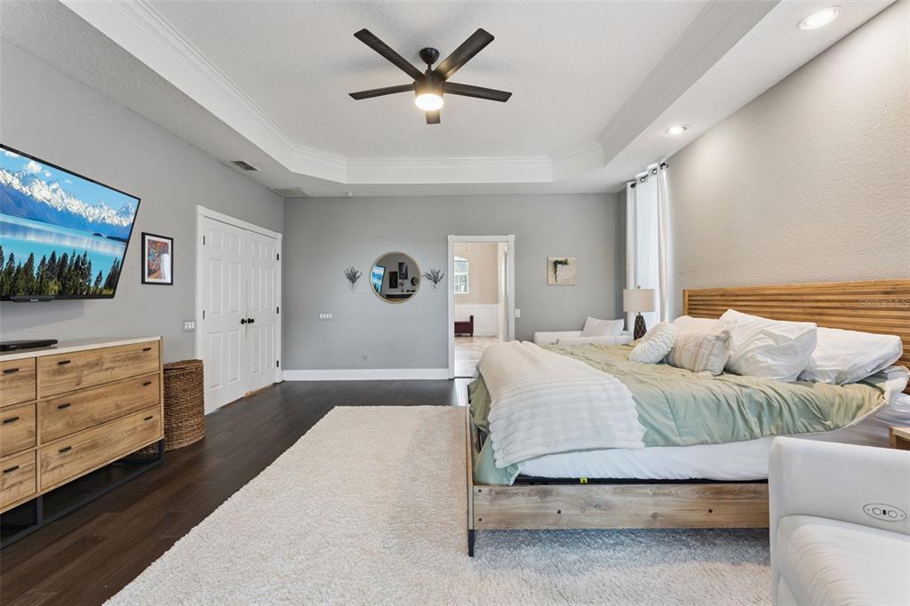 12736 Lake Ridge Circle Clermont, FL 34711 - Photo 24 of 56 a bedroom with a bed and a dresser