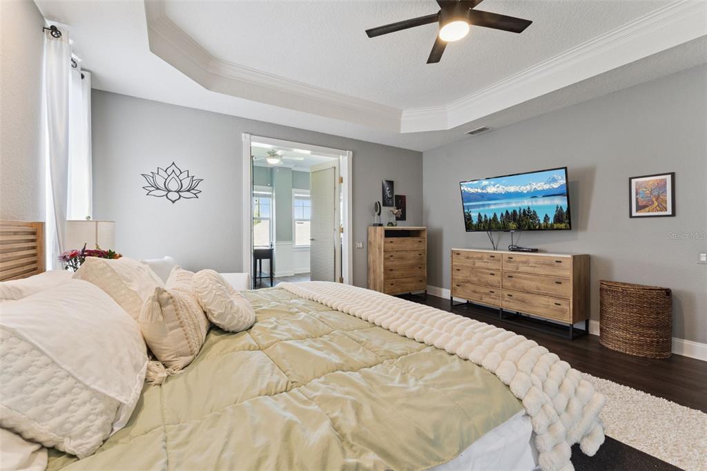 12736 Lake Ridge Circle Clermont, FL 34711 - Photo 25 of 56 a bedroom with a bed and a television