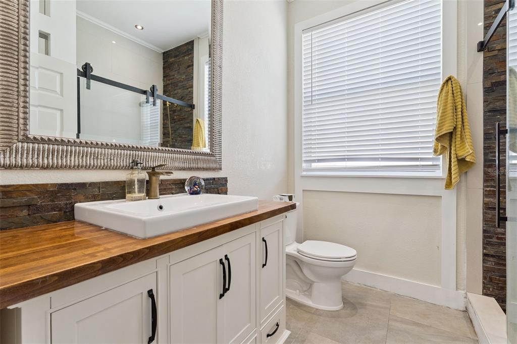 12736 Lake Ridge Circle Clermont, FL 34711 - Photo 30 of 56 a bathroom with a sink and a toilet