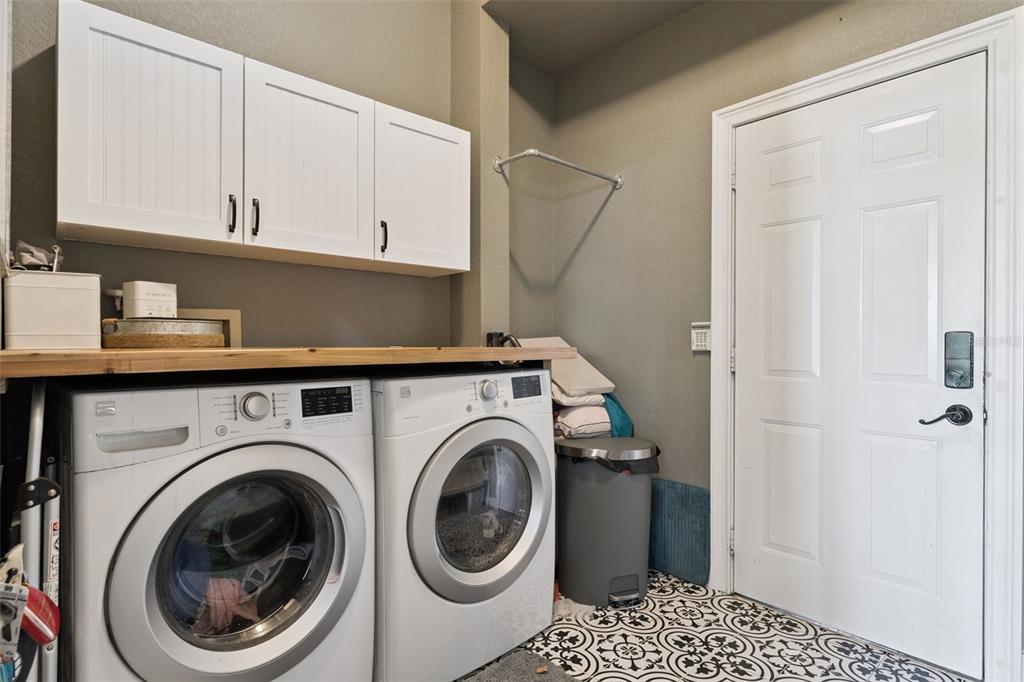 12736 Lake Ridge Circle Clermont, FL 34711 - Photo 33 of 56 a close view of a utility room with washer and dryer