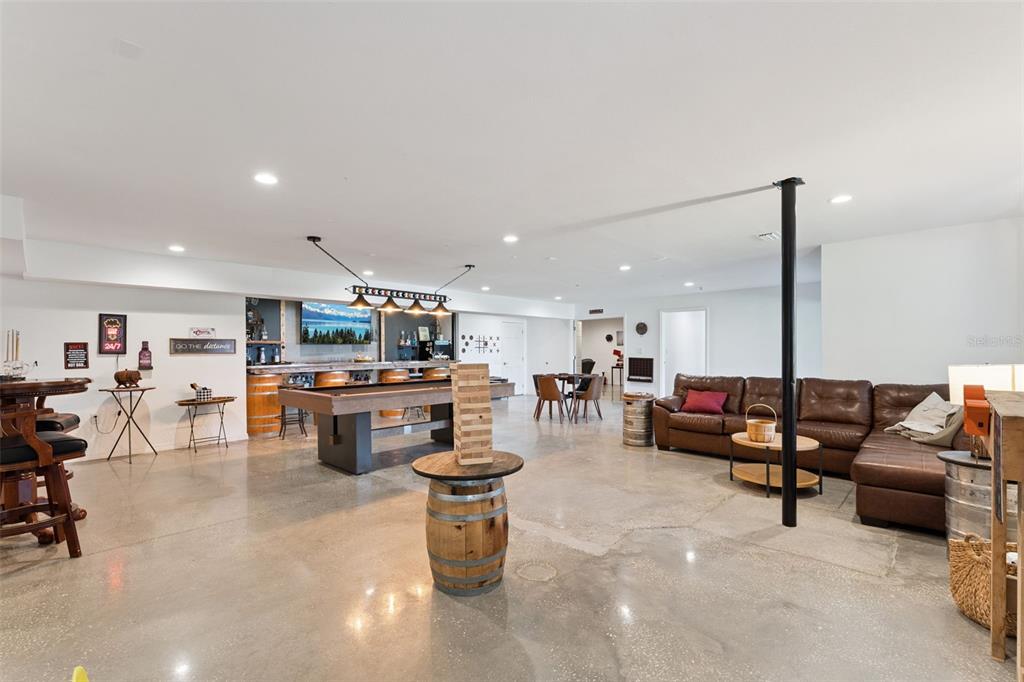 12736 Lake Ridge Circle Clermont, FL 34711 - Photo 39 of 56 a living room with lots of furniture and a large mirror