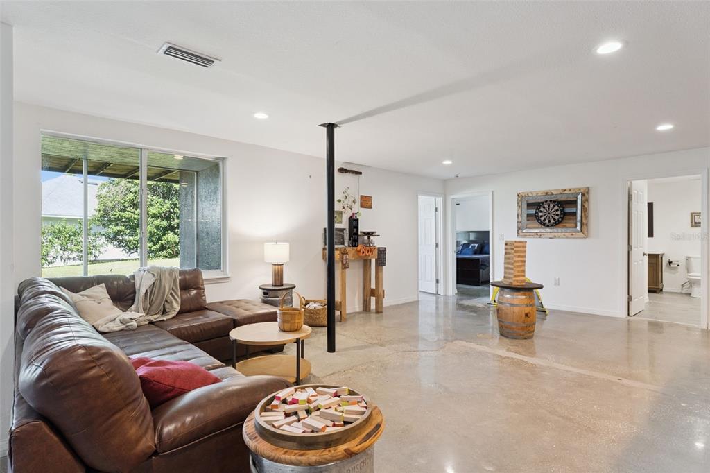 12736 Lake Ridge Circle Clermont, FL 34711 - Photo 40 of 56 a living room with furniture and a large window