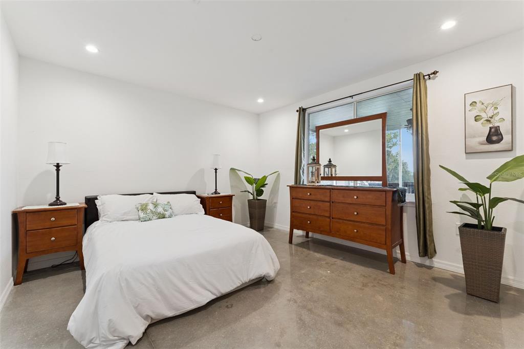 12736 Lake Ridge Circle Clermont, FL 34711 - Photo 45 of 56 a bedroom with a bed and a dresser