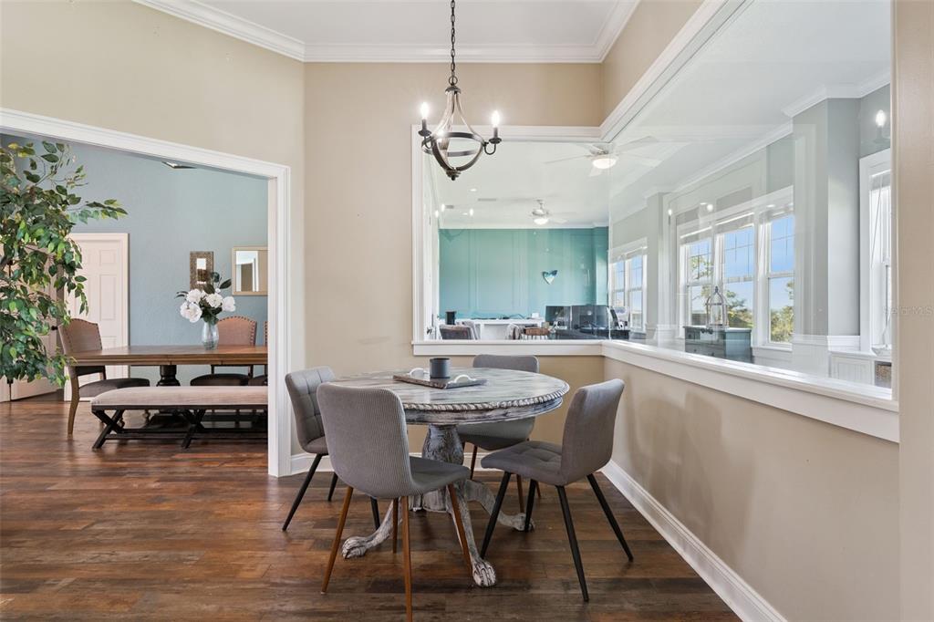 12736 Lake Ridge Circle Clermont, FL 34711 - Photo 9 of 56 a view of a dining room with furniture window and wooden floor