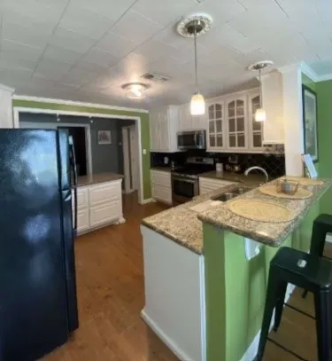 a kitchen with lots of counter space and a sink