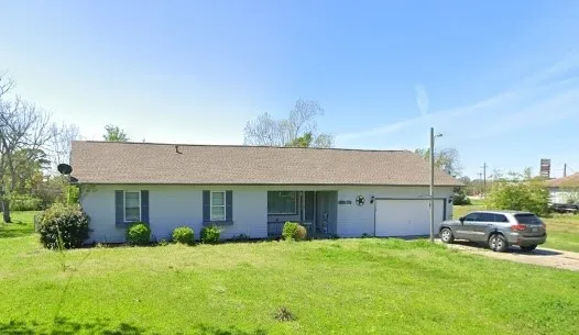 a house view with a garden space