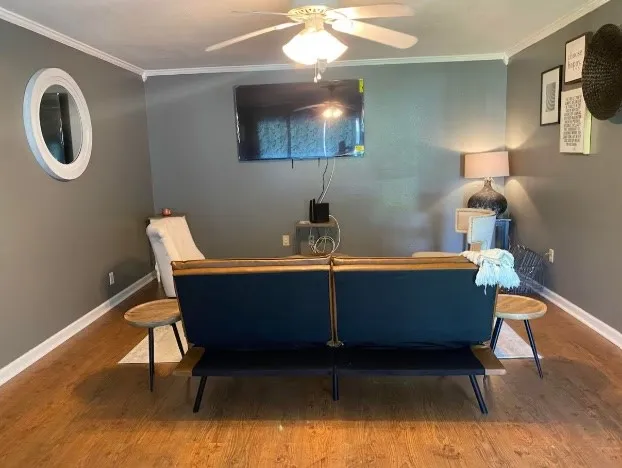 a room with a table chairs and a lamp