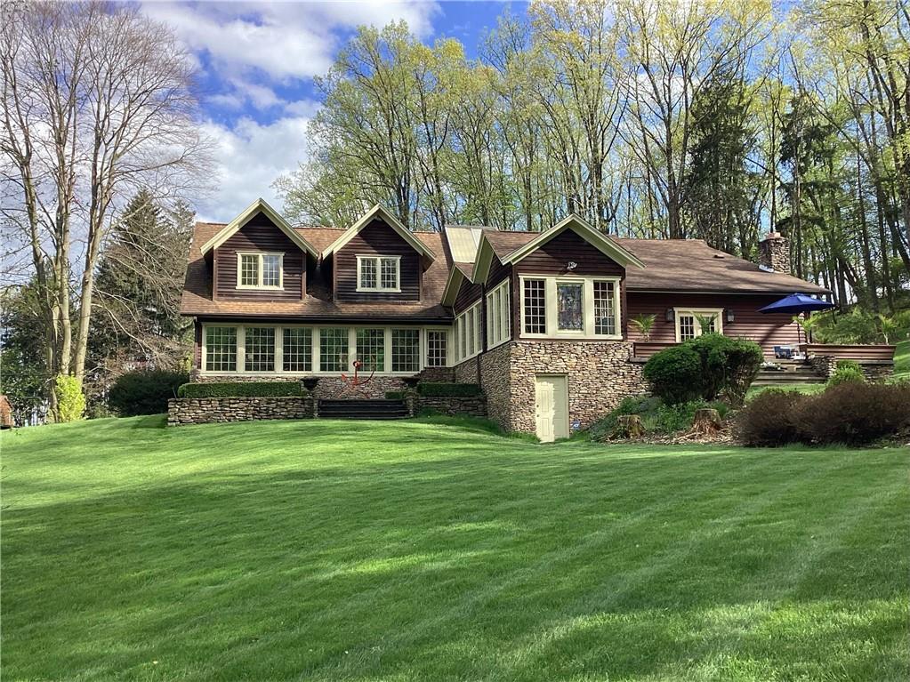 1536 Indian Springs Road Indiana, PA 15701 - Photo 1 of 43 a front view of a house with a garden