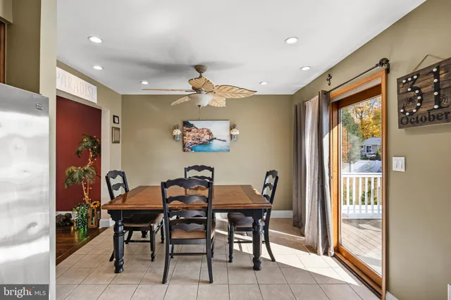 a view of a dining room with furniture and a window