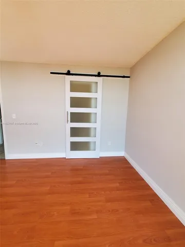 a view of an empty room with a window