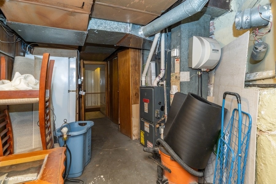 2347 West Maypole Avenue Chicago, IL 60612 - Photo 18 of 20 a view of walk in closet with clothes and shoes