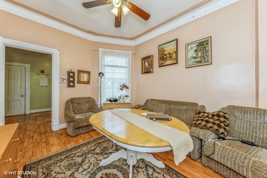 2347 West Maypole Avenue Chicago, IL 60612 - Photo 2 of 20 a living room with furniture and a rug