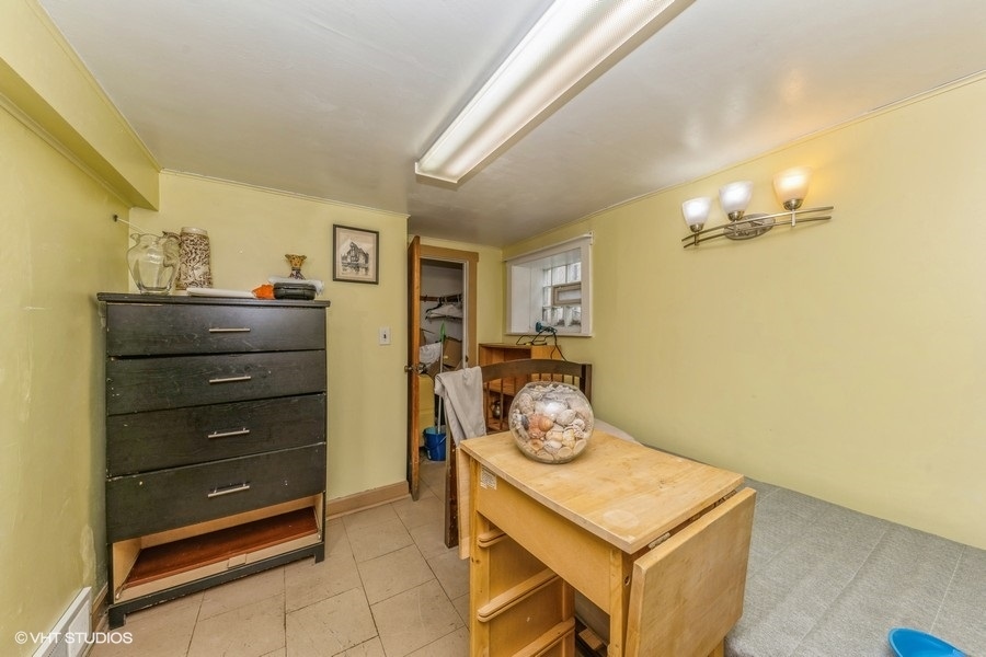 2347 West Maypole Avenue Chicago, IL 60612 - Photo 8 of 20 a room with a stove and a mirror