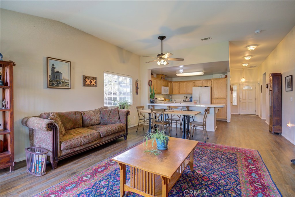 705 Turtle Creek Road Paso Robles, CA 93446 - Photo 4 of 14 a living room with furniture and a dining table