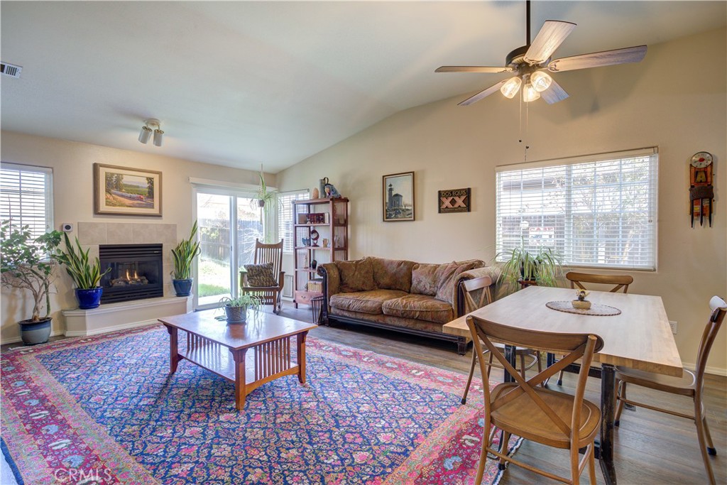 705 Turtle Creek Road Paso Robles, CA 93446 - Photo 5 of 14 a living room with furniture a fireplace and a table