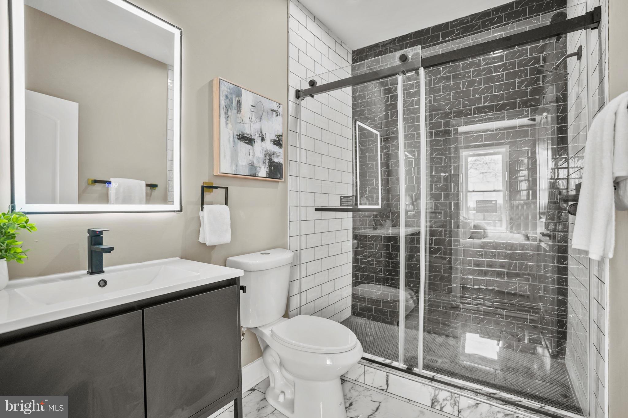 1714 East 28th Street Baltimore, MD 21218 - Photo 13 of 27 Sleek modern bathroom oasis.