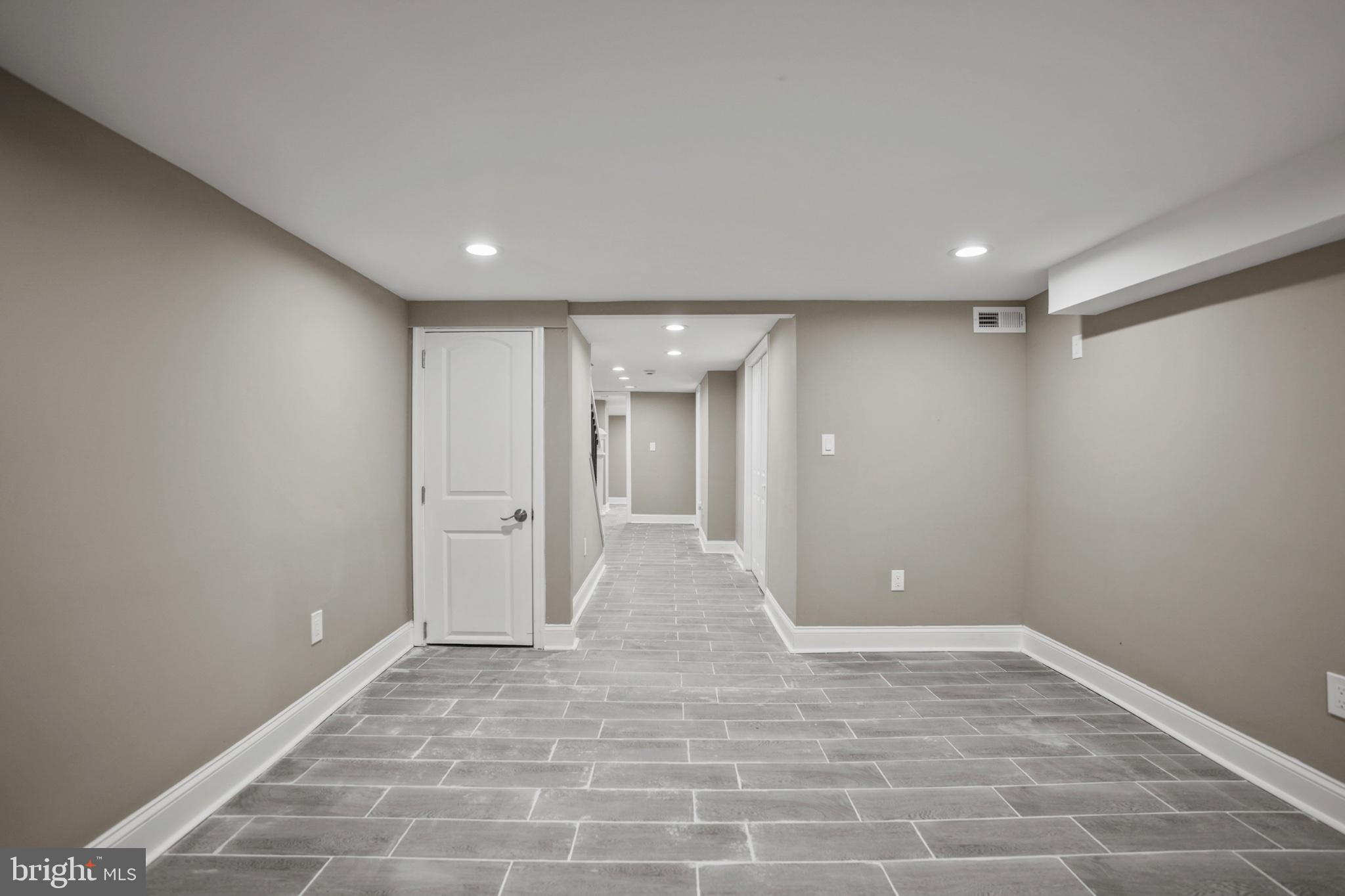 1714 East 28th Street Baltimore, MD 21218 - Photo 24 of 27 Spacious, modern basement retreat.
