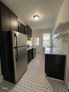 200 East Edenton Street, Unit 4 Raleigh, NC 27601 - Photo 8 of 17 a kitchen with granite countertop a refrigerator and a sink