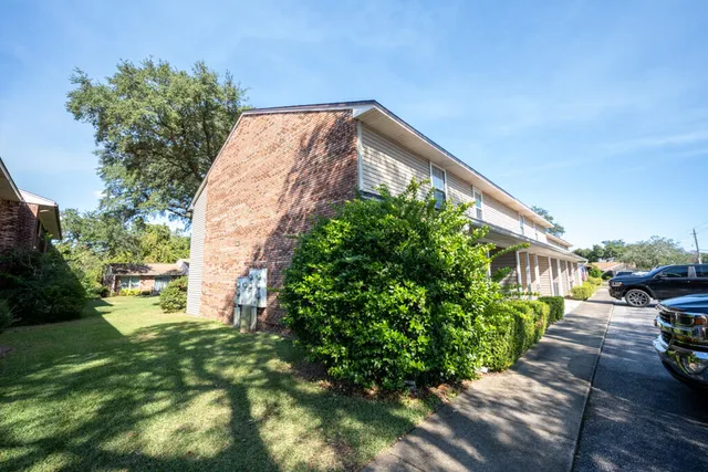 a backyard of a house with lots of green space