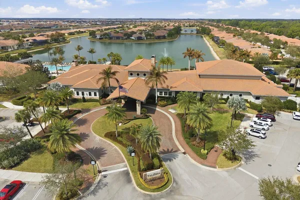 an aerial view of a swimming pool and mountain