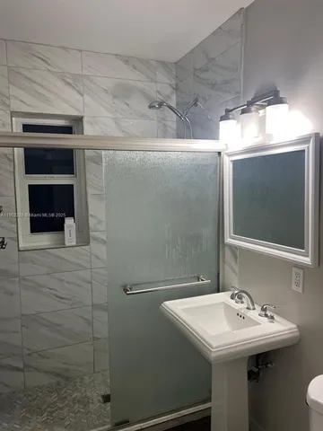 a bathroom with a sink and mirror
