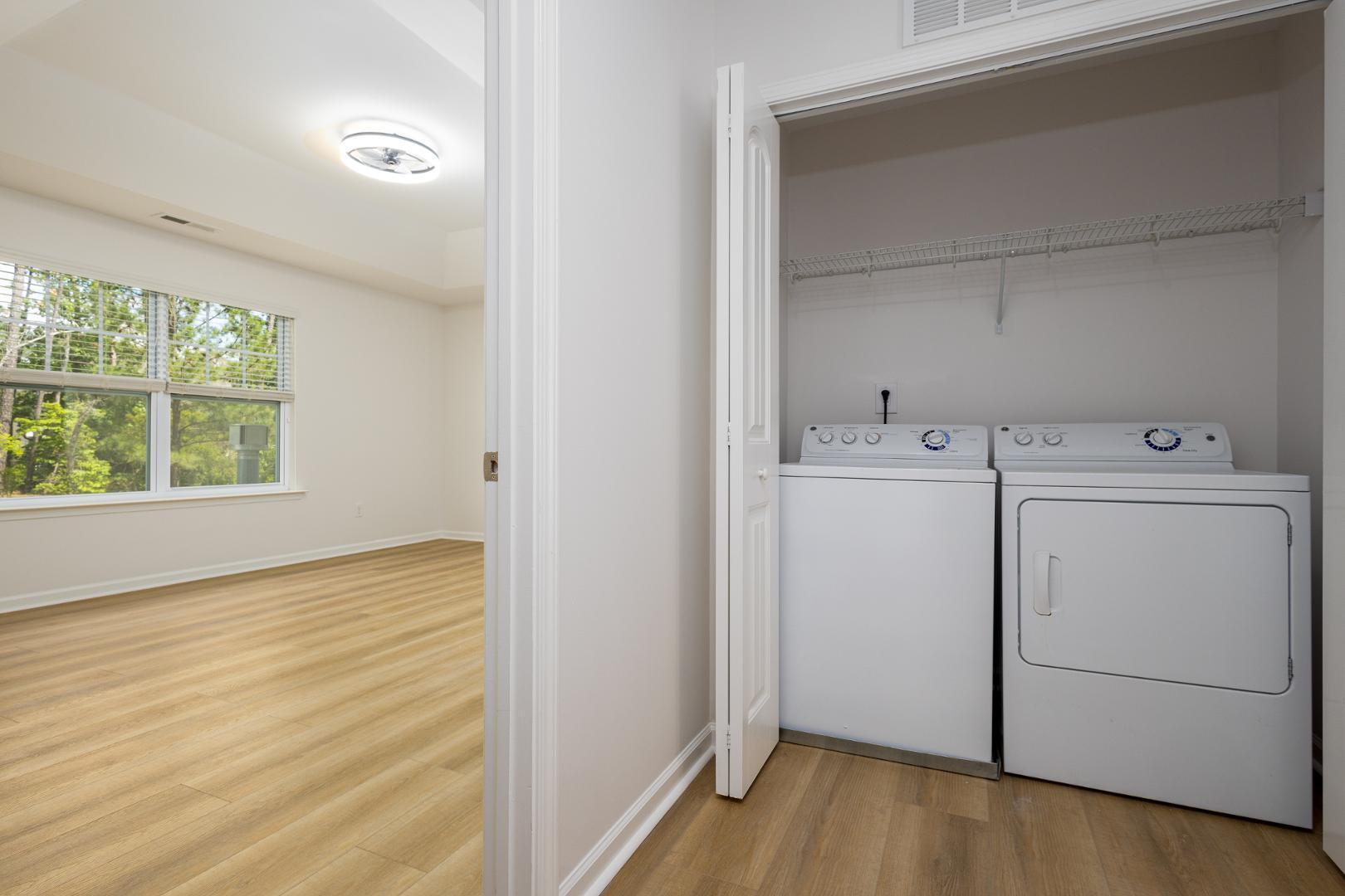 228 Skyros Loop Cary, NC 27519 - Photo 15 of 29 a view of a storage & utility room with washer and dryer