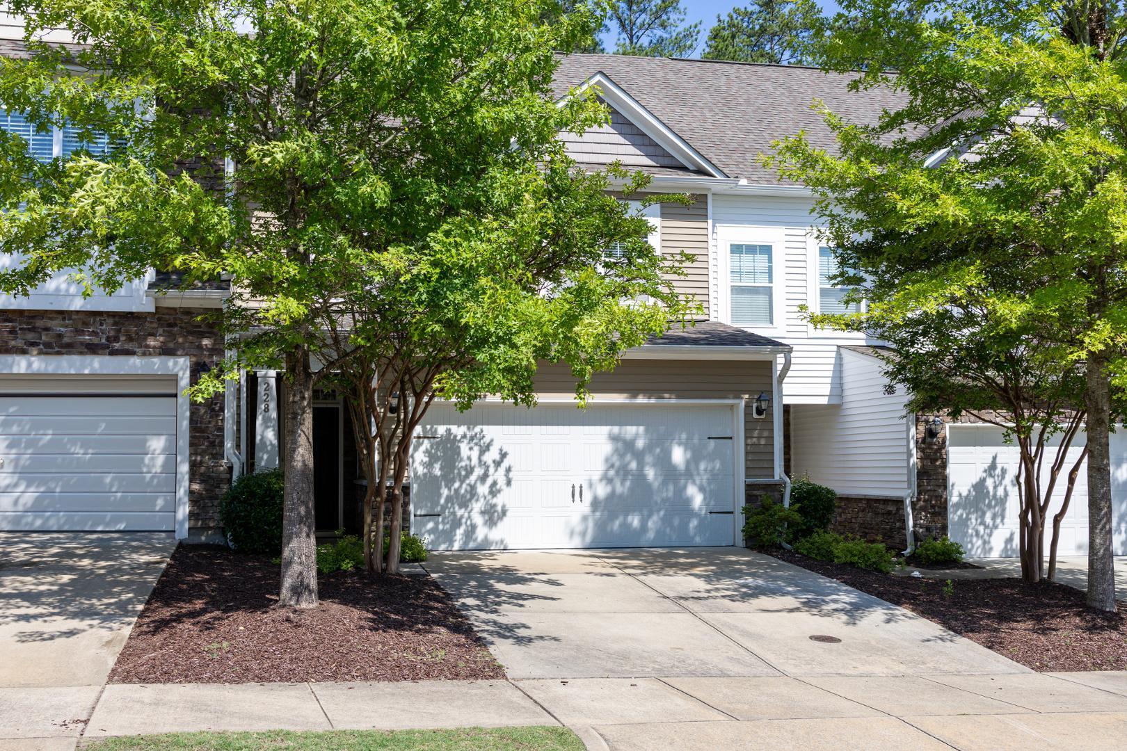 228 Skyros Loop Cary, NC 27519 - Photo 18 of 29 a front view of a house with garden